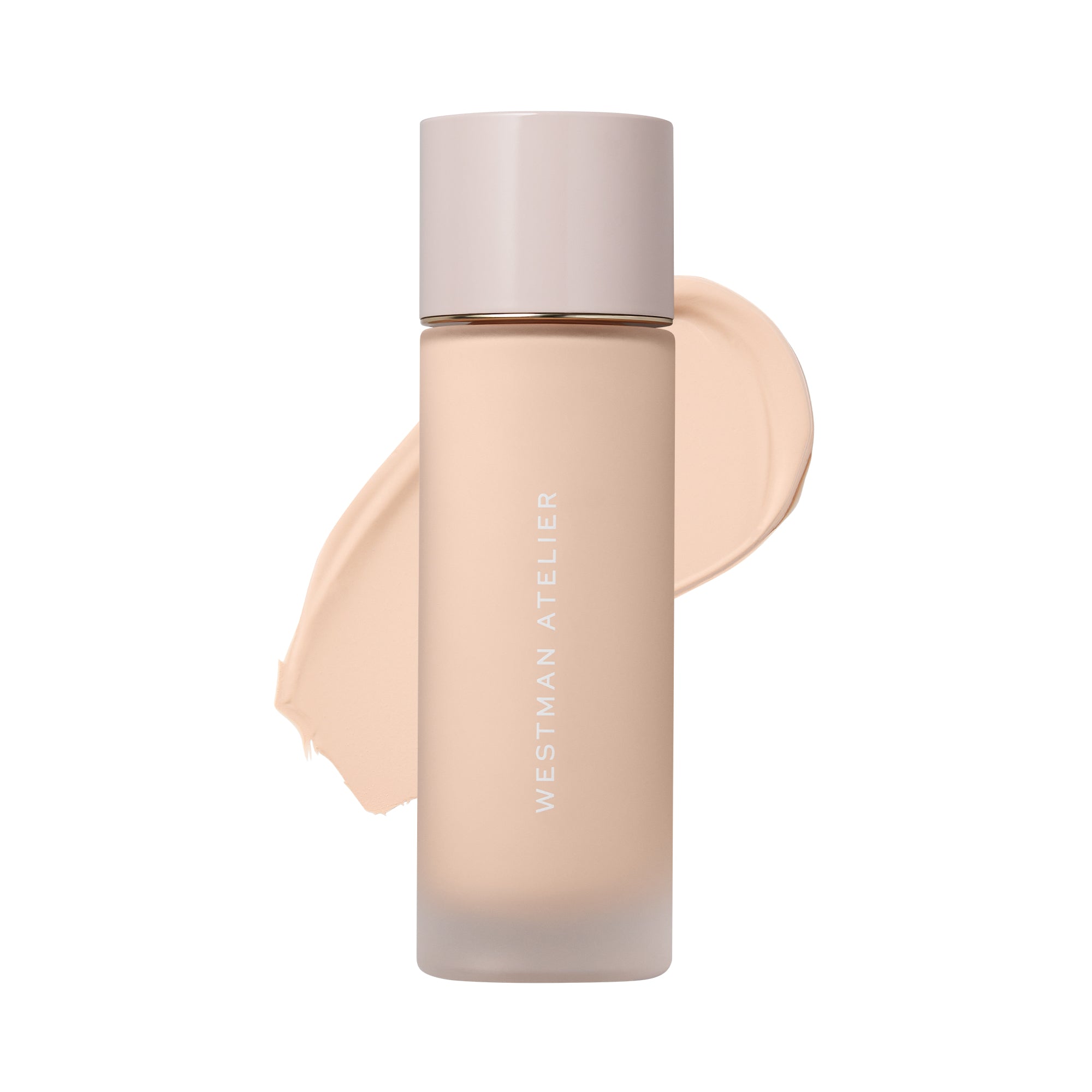 Westman Atelier liquid foundation in a frosted glass bottle with a pale pink cap, shown with a beige foundation swatch behind it on a white background.
