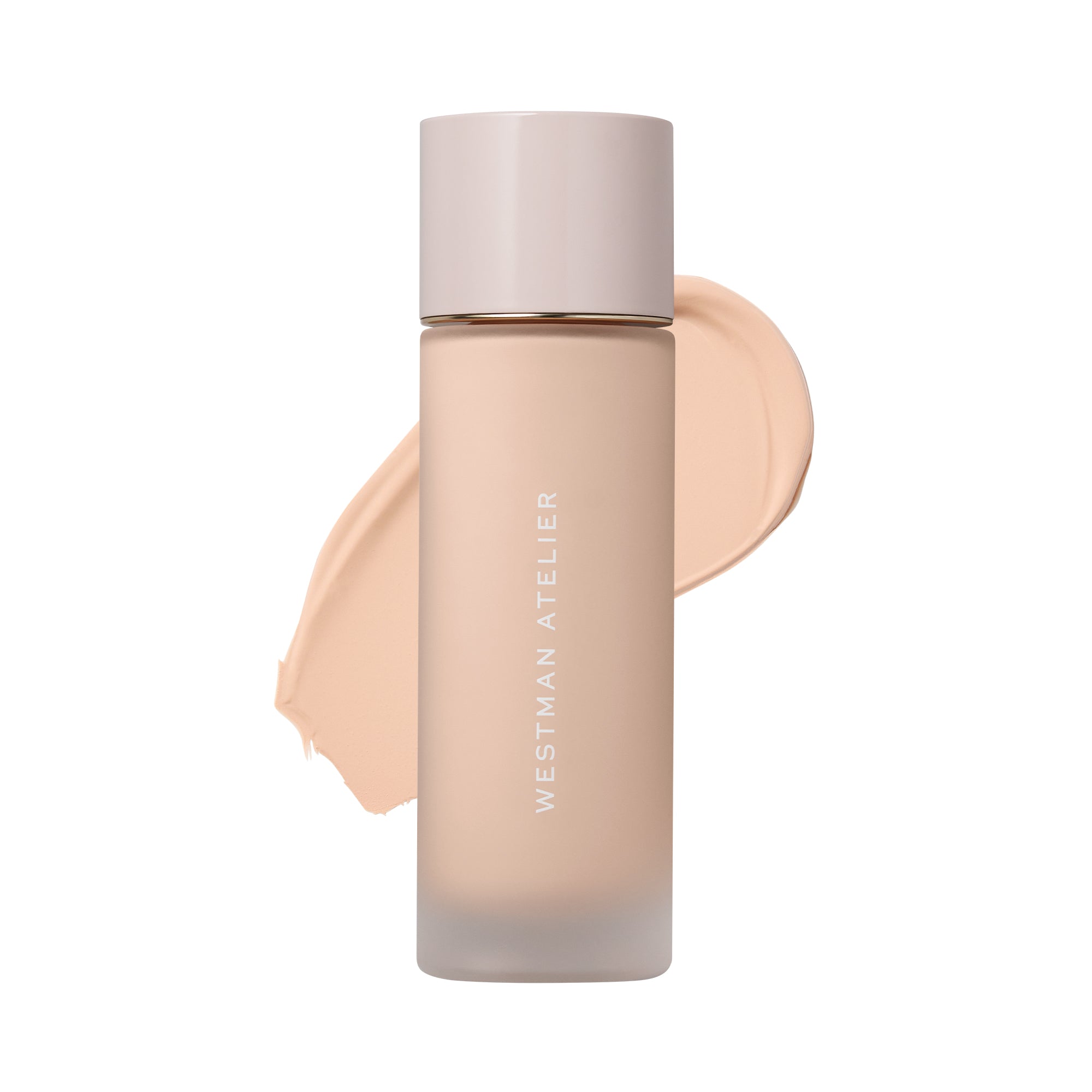 Westman Atelier liquid foundation in a frosted glass bottle with a pale pink cap, shown with a beige foundation swatch behind it on a white background.