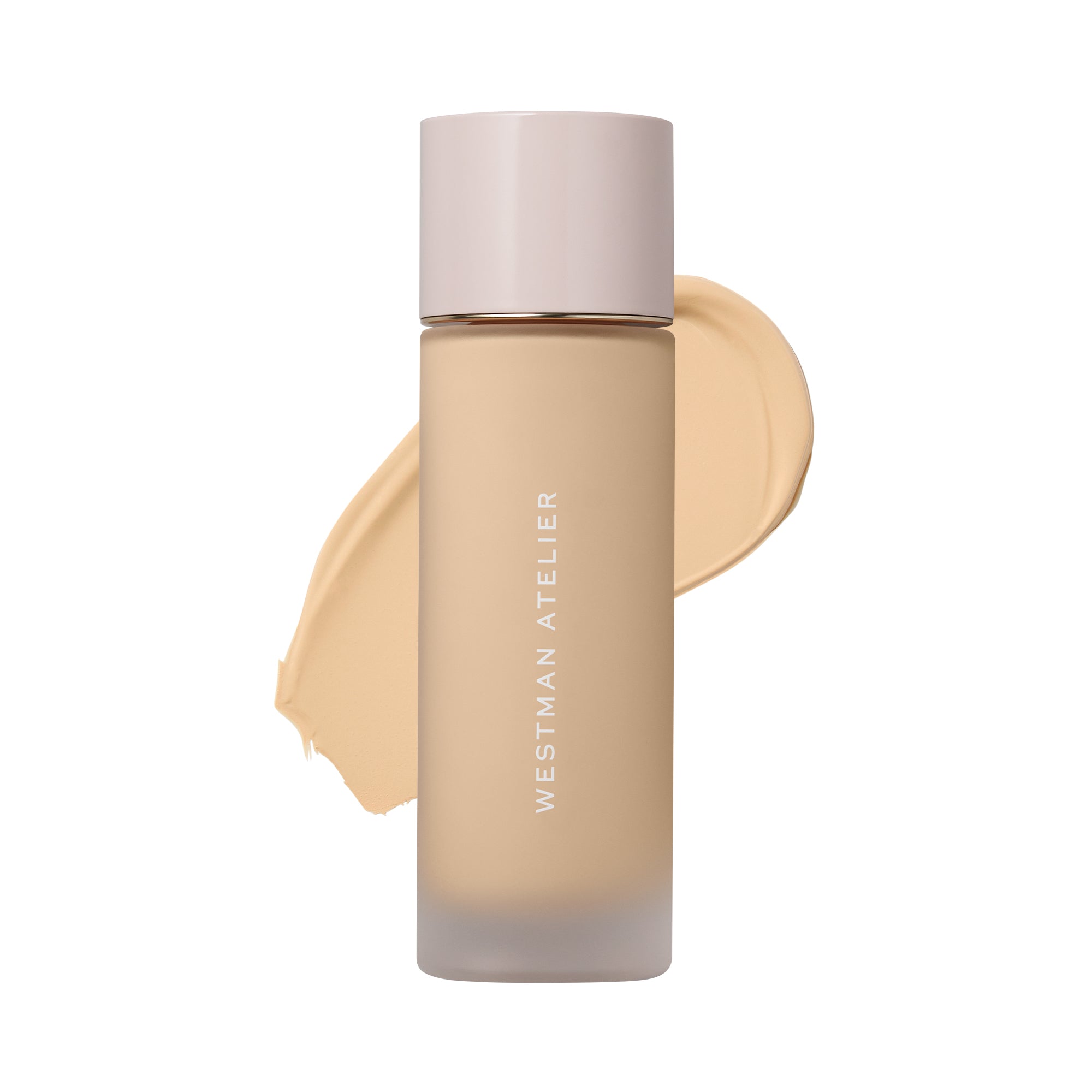 Westman Atelier liquid foundation in a frosted glass bottle with a pale pink cap, shown against a white background with a beige foundation swatch behind it.