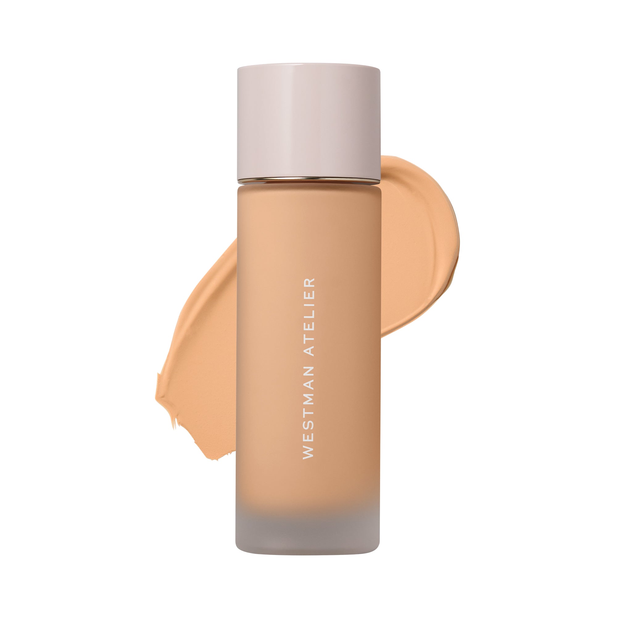 Westman Atelier liquid foundation in a frosted glass bottle with a pale pink cap, shown against a white background with a beige foundation swatch behind it.