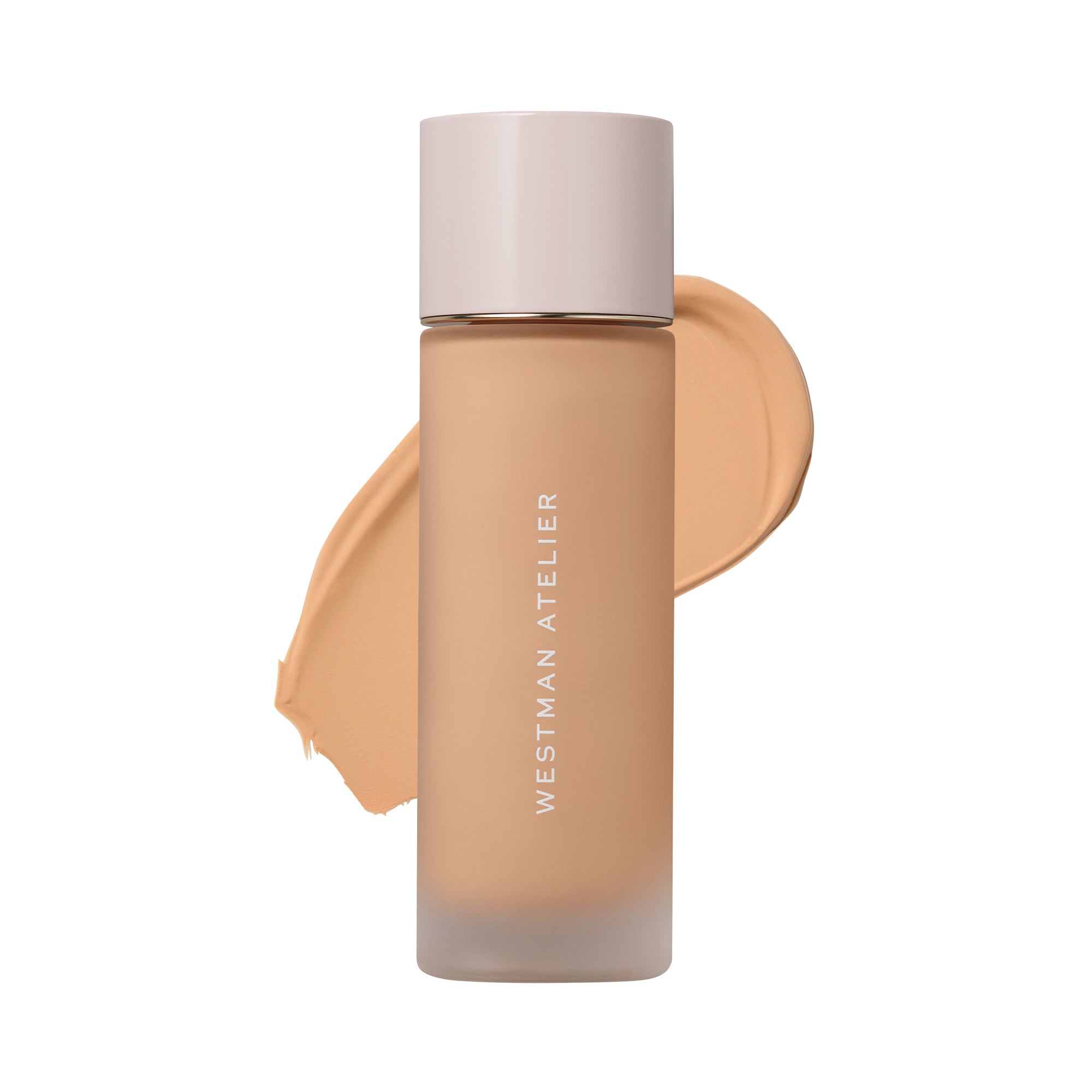 Westman Atelier liquid foundation in a frosted glass bottle with a pale pink cap, shown against a white background with a beige foundation swatch behind it.
