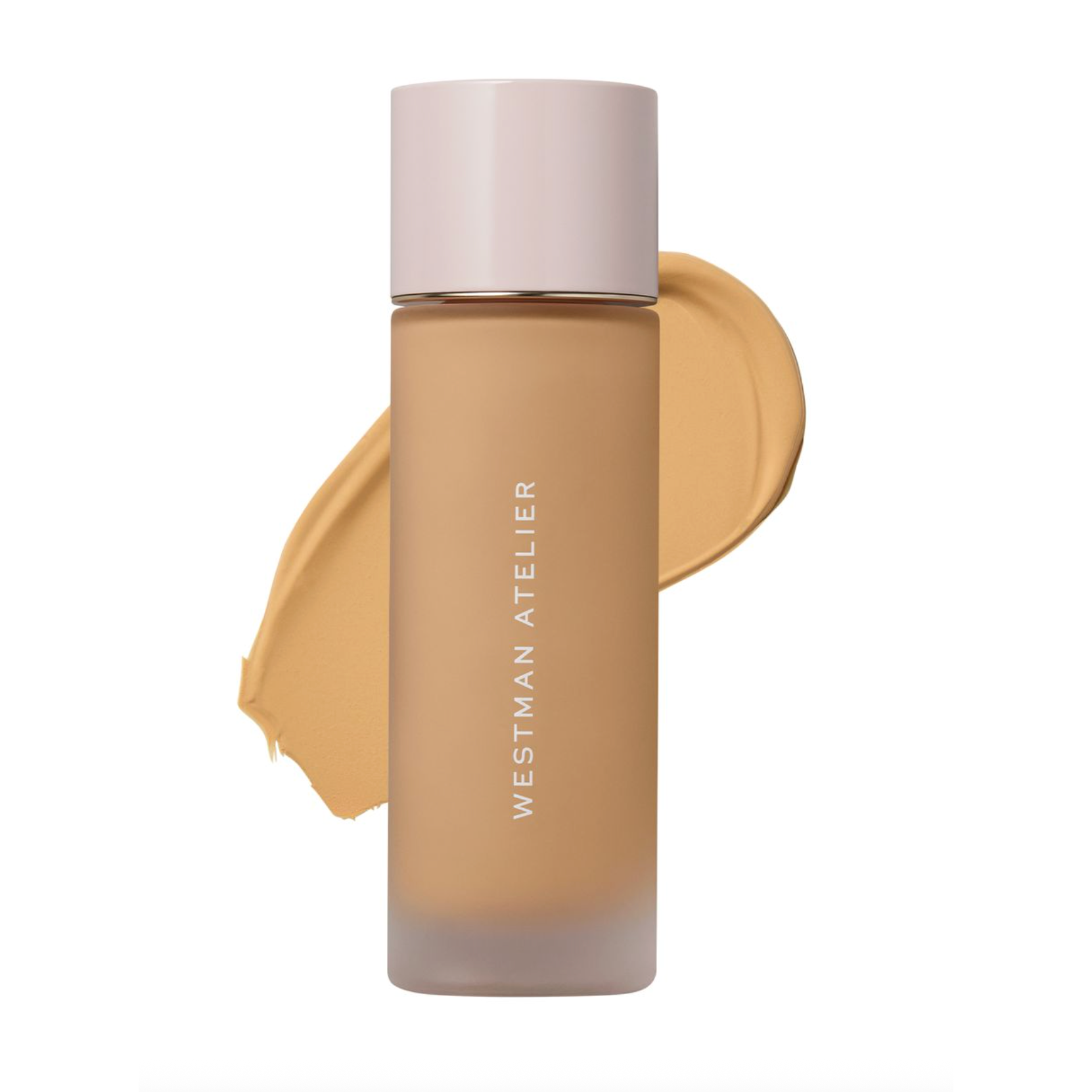 Westman Atelier liquid foundation in a frosted glass bottle with a pale pink cap, shown against a white background with a beige makeup swatch behind it.
